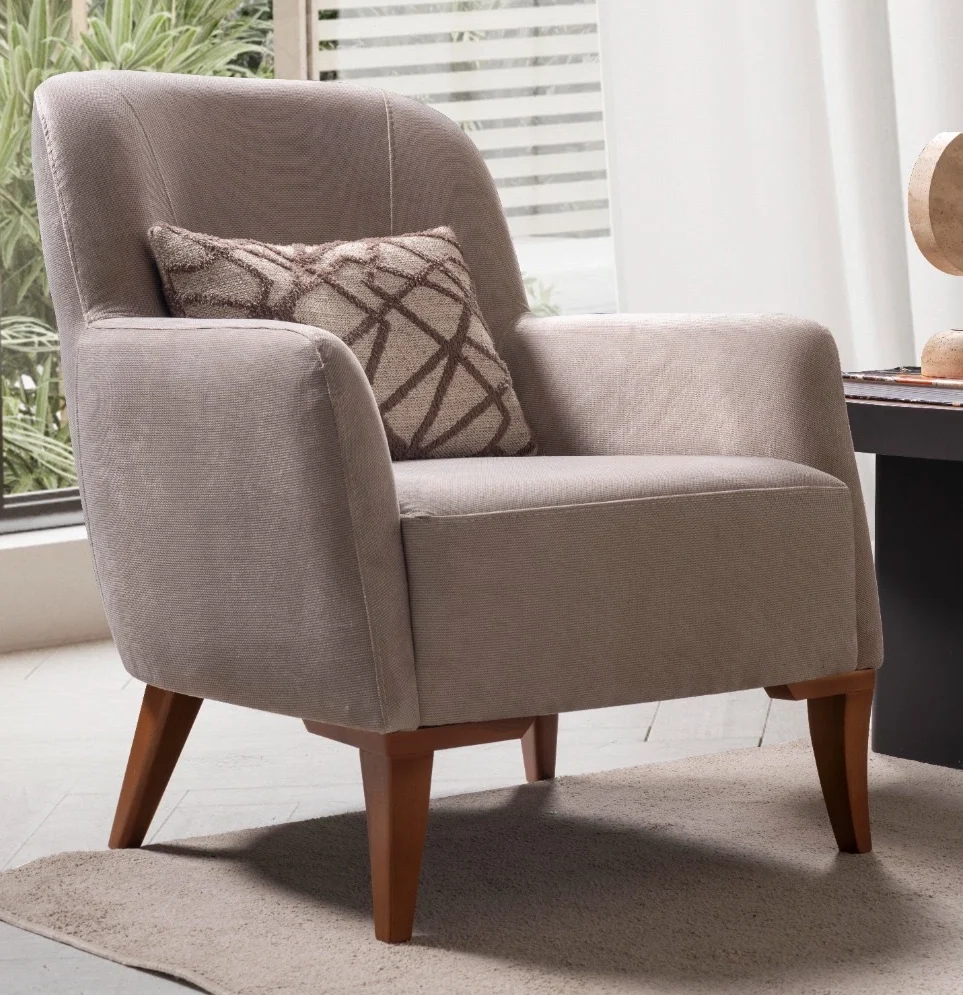 Bria armchair 1 Bria Armchair featuring a high-back upholstered design, comfortable throw cushion, and tapered wooden legs.