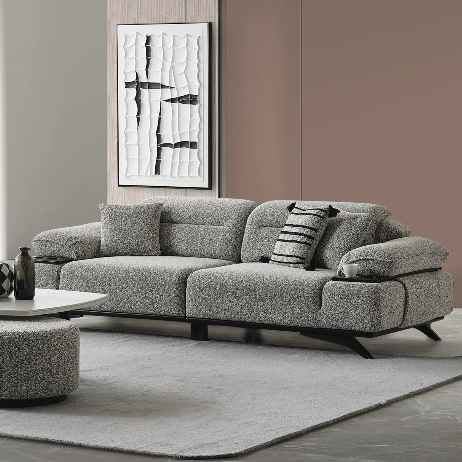 Coaley-Sofa-Modern-Sofas-From-Turkey-1 The elite Coaley Sofa featuring grey textured upholstery and sleek black legs, arranged in a high-end, modern living room that embodies a prestigious and balanced lifestyle.