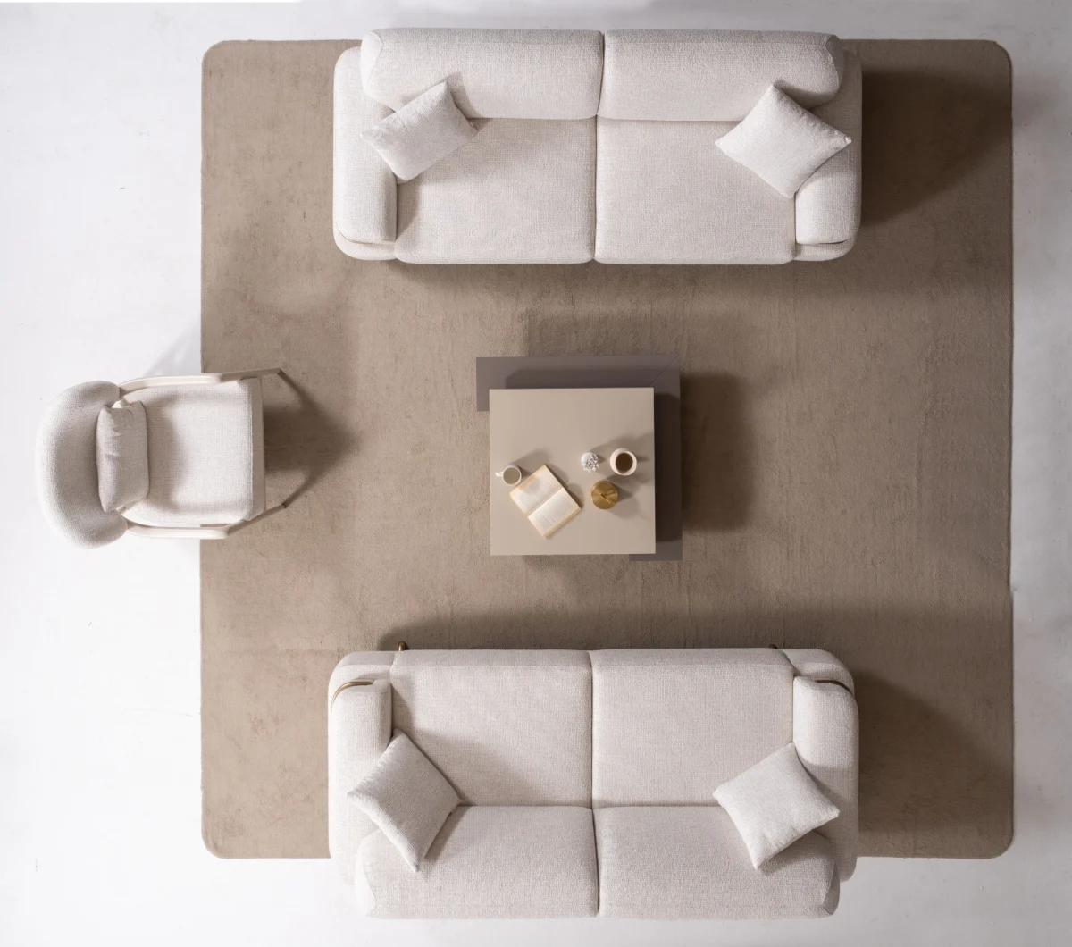 Cora Sofa Set featuring two sofas and an armchair arranged around a coffee table in a modern living room setting.