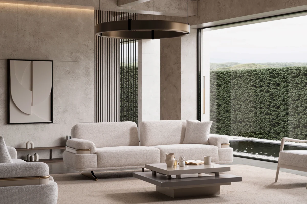 Cora Sofa styled in a modern interior setting with curved armrests and a wide seating surface.