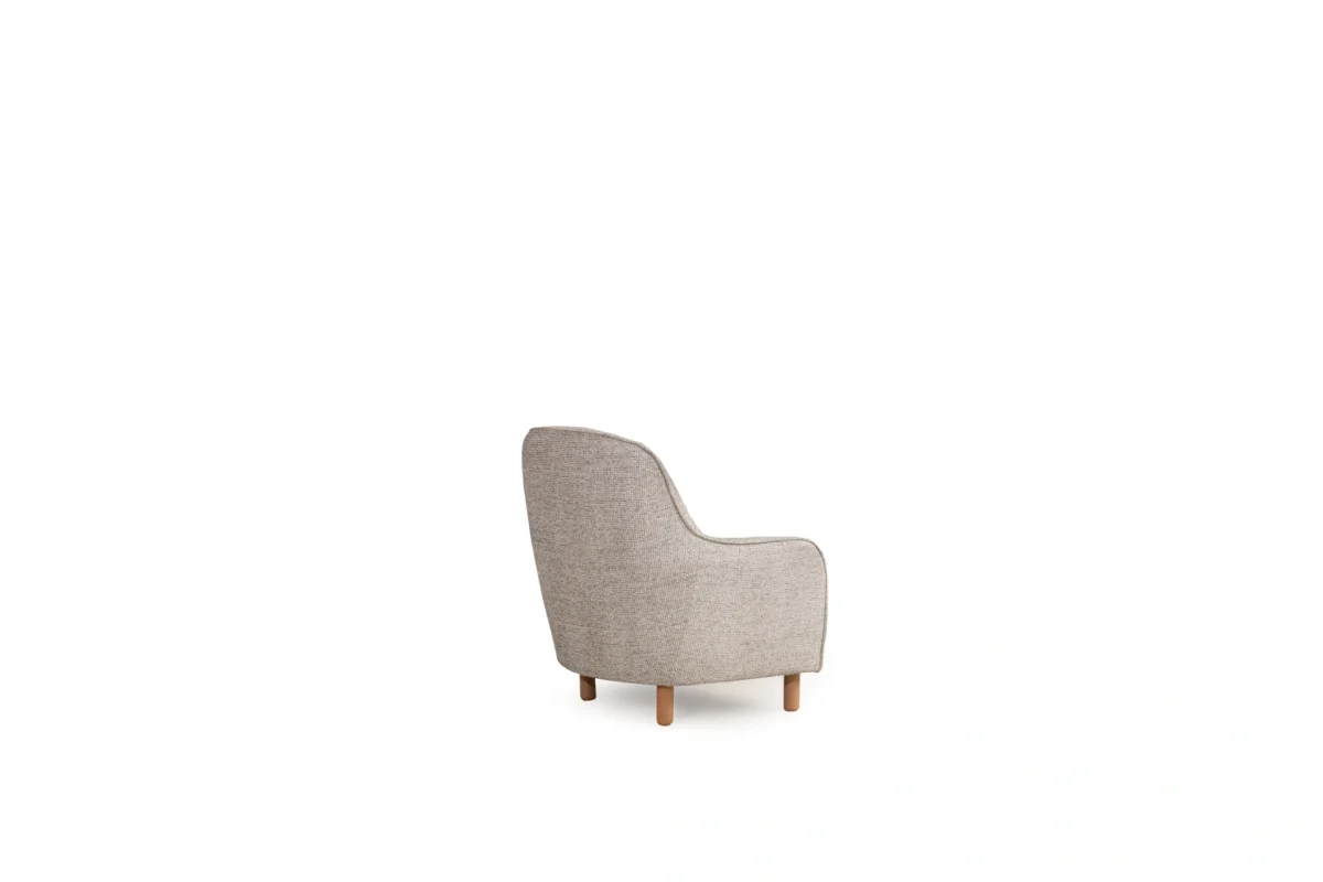 The Elina Armchair is a masterpiece of modern minimalism. With its soft curves and premium textured upholstery, it brings a touch of sophisticated comfort to every corner of your home.