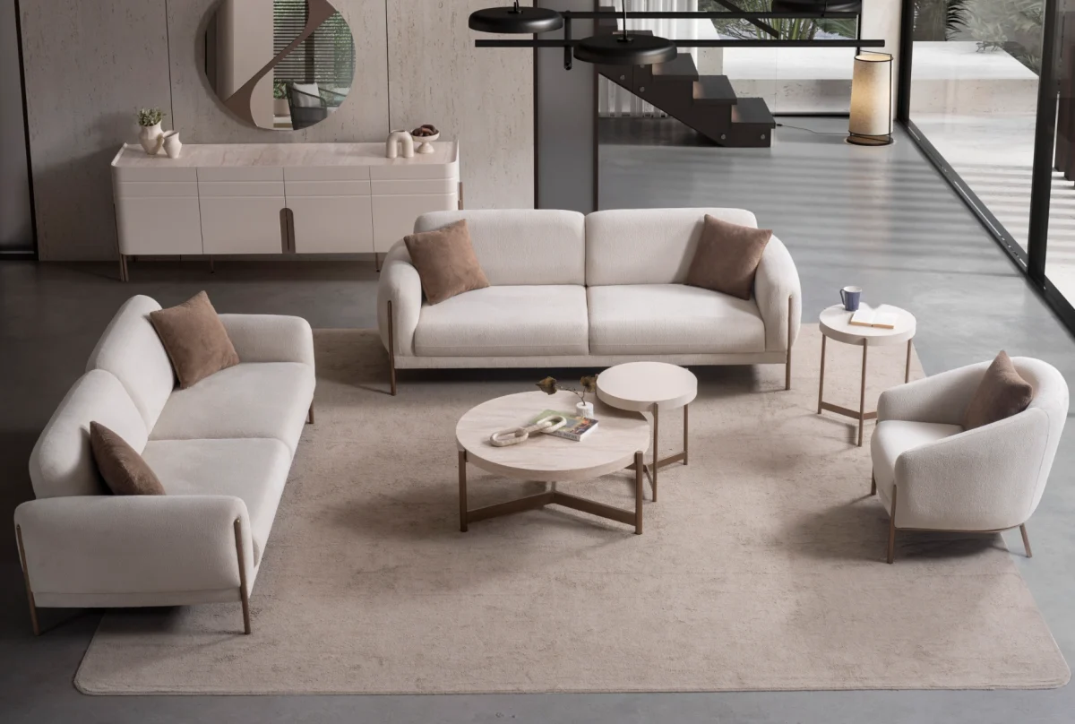 Elora Set Sofa featuring modern mechanism sofas and a tub-style armchair arranged in a spacious living room setting.