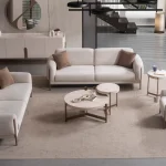 Elora Set Sofa featuring modern mechanism sofas and a tub-style armchair arranged in a spacious living room setting.