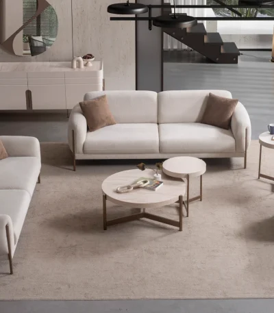 Elora Set Sofa featuring modern mechanism sofas and a tub-style armchair arranged in a spacious living room setting.