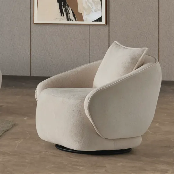 A modern living room featuring the Grace Sofa. The arrangement displays a plush taupe sofa and a matching cream sofa, both designed with distinctive integrated wooden side tables on the armrests and angled wooden legs. A white swivel armchair and a round wooden coffee table complete the cozy, contemporary look of this furniture from Turkey.