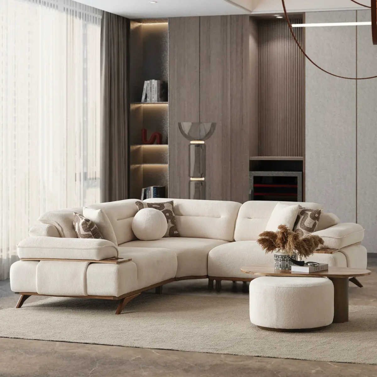 A modern living room featuring the Grace Sofa. The arrangement displays a plush taupe sofa and a matching cream sofa, both designed with distinctive integrated wooden side tables on the armrests and angled wooden legs. A white swivel armchair and a round wooden coffee table complete the cozy, contemporary look of this furniture from Turkey.