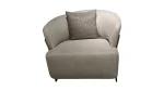 A luxurious modular Grandeur sofa set in a bright, modern living room. The set features cream-colored fabric upholstery with rectangular cushions and sleek gold metallic legs. Beside the modular sections sits a matching rounded armchair with gold accents. The scene includes minimalist decor, a marble coffee table, and large windows, highlighting the elegant design of the Grandeur furniture from Turkey.