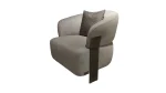 A luxurious modular Grandeur sofa set in a bright, modern living room. The set features cream-colored fabric upholstery with rectangular cushions and sleek gold metallic legs. Beside the modular sections sits a matching rounded armchair with gold accents. The scene includes minimalist decor, a marble coffee table, and large windows, highlighting the elegant design of the Grandeur furniture from Turkey.