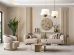 A luxurious modular Grandeur sofa set in a bright, modern living room. The set features cream-colored fabric upholstery with rectangular cushions and sleek gold metallic legs. Beside the modular sections sits a matching rounded armchair with gold accents. The scene includes minimalist decor, a marble coffee table, and large windows, highlighting the elegant design of the Grandeur furniture from Turkey.