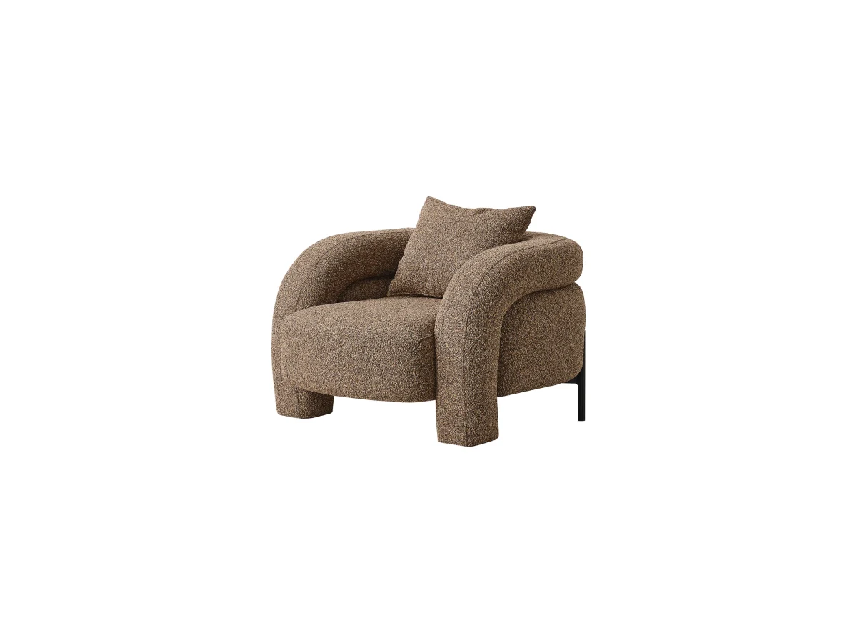 The distinguished Harmoni Armchair in a bright, modern interior with curved architectural details and warm brown accents, embodying a sense of balance and harmony.