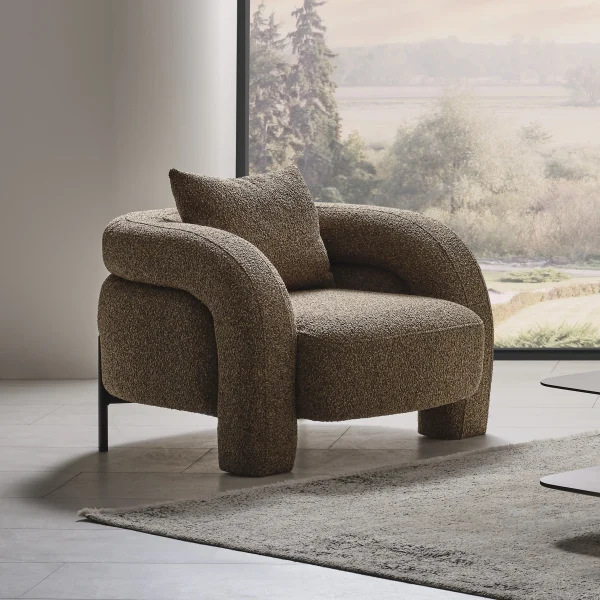 The distinguished Harmoni Armchair in a bright, modern interior with curved architectural details and warm brown accents, embodying a sense of balance and harmony.