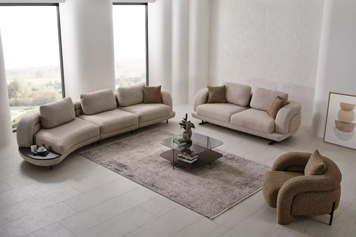 Close-up of the Harmoni Prime Lounge Soft Set featuring its sculptural curved silhouette, premium off-white bouclé upholstery, and seamless modular segments designed for ergonomic luxury.