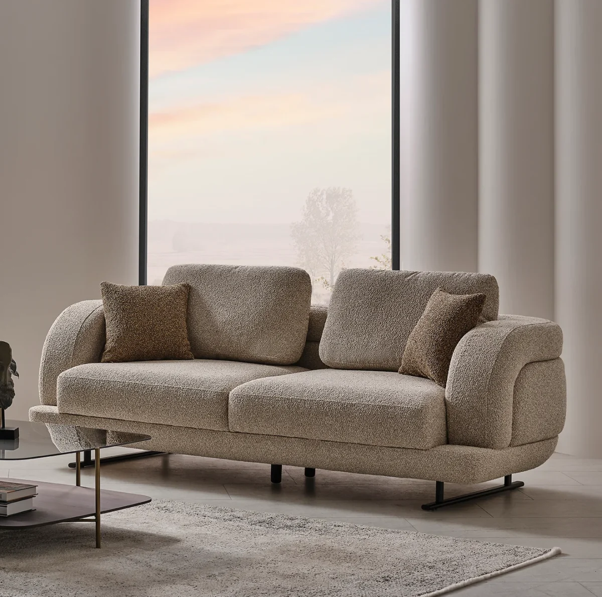 The distinguished Harmoni Sofa in a bright, modern interior with curved architectural details and warm brown accents, embodying a sense of balance and harmony.