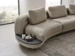 Harmoni Sofa 3-Seater Curve Edition featuring a sophisticated organic silhouette, premium textured bouclé fabric, and a sleek integrated minimalist side table on a low-profile base.