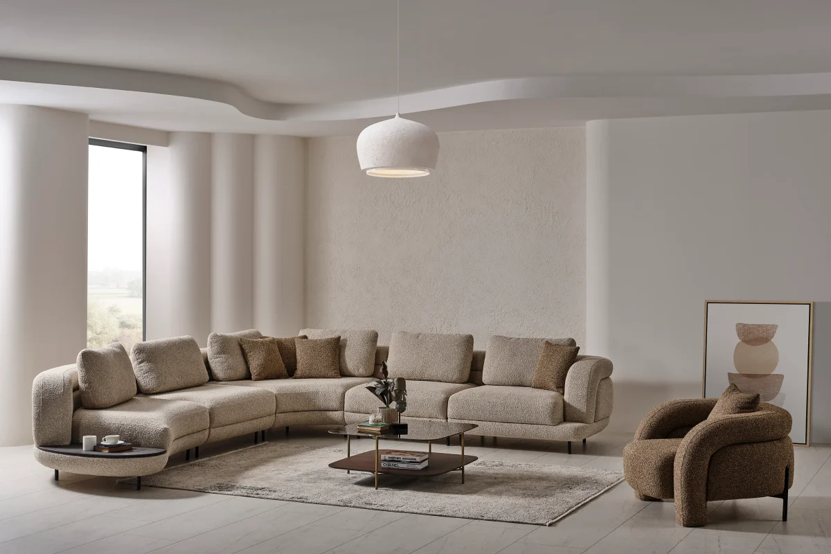 Harmoni Prime Lounge Soft Trio Set featuring a large curved modular sofa in cream, paired with a matching accent chair, modern interior.