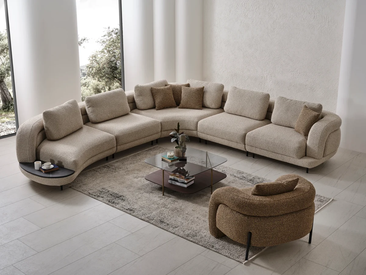 Harmoni Corner Sofa Prime Lounge Soft Trio Set featuring a large curved modular sofa in cream, paired with a matching accent chair, modern interior.