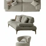A modern Horizon Sofa set arranged in a chic living room. The furniture features textured grey upholstery with distinctive folded armrests and sleek champagne gold metallic legs. A matching round swivel armchair and a white coffee table with a cylindrical pouf complete the contemporary Turkish furniture ensemble.