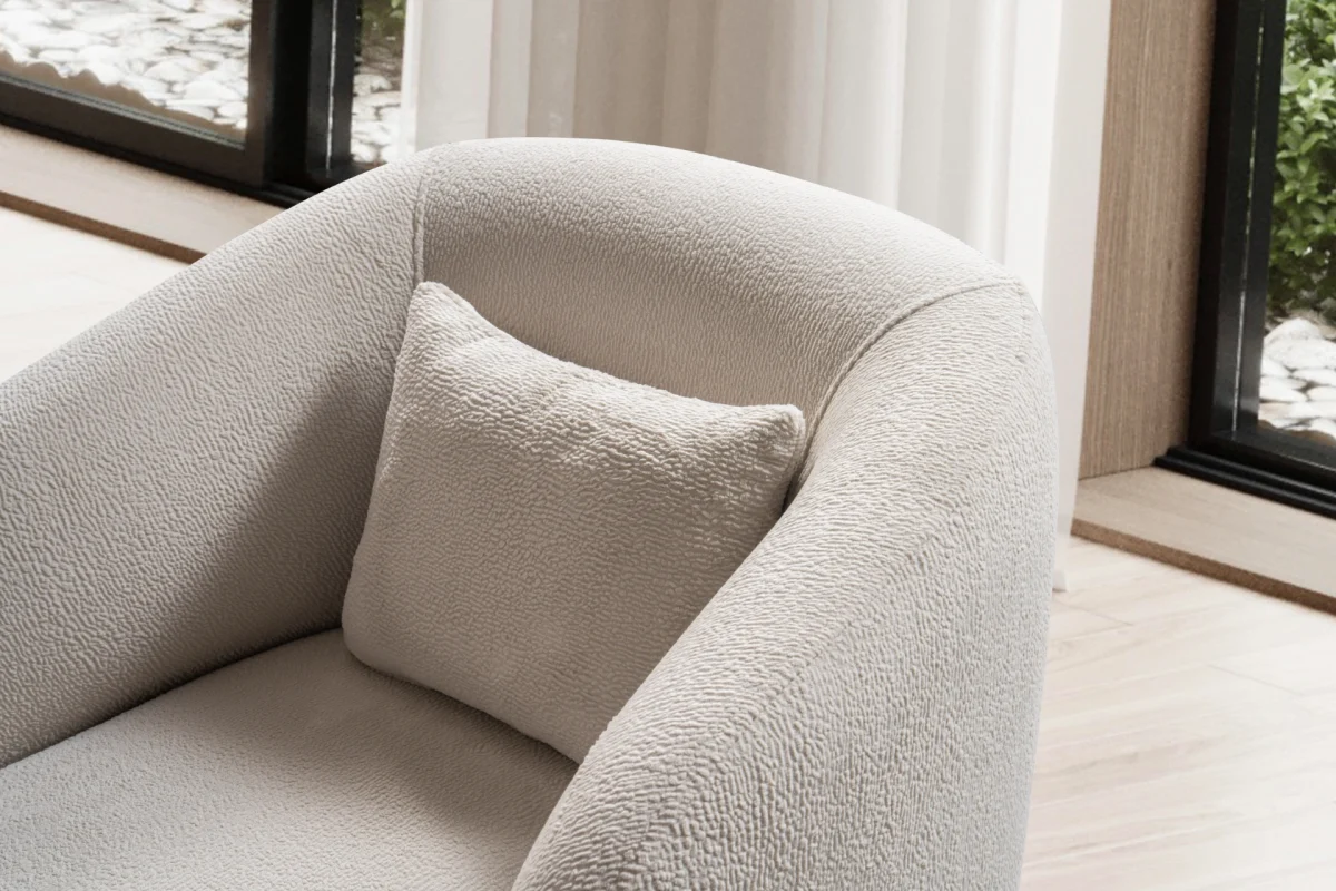 Laos Armchair - Minimalist rounded boucle accent chair with tapered wooden legs.