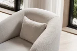 Laos Armchair - Minimalist rounded boucle accent chair with tapered wooden legs.
