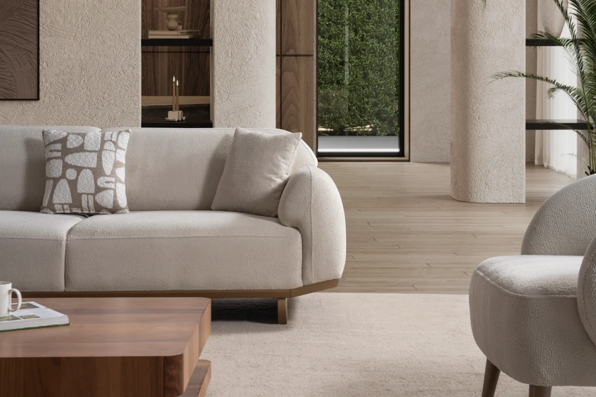 Modern rounded sofa with white boucle fabric and wooden base, luxury turkish furniture.