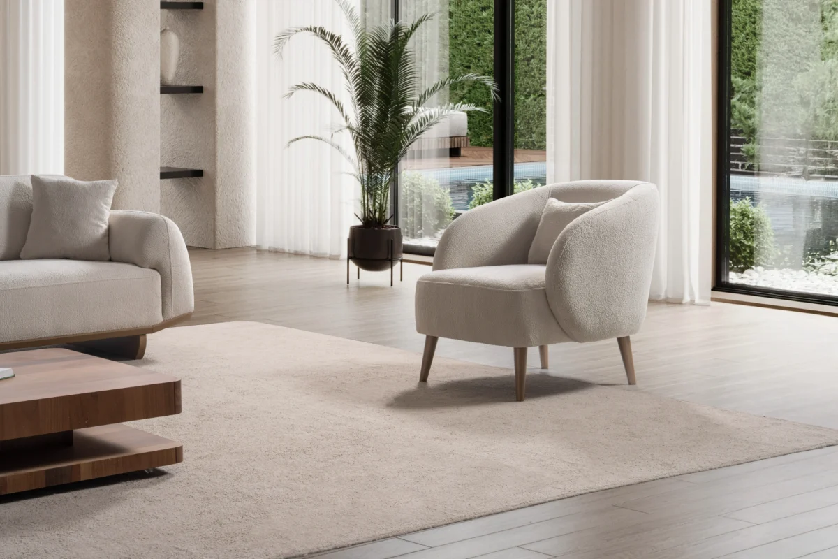 Laos Armchair - Minimalist rounded boucle accent chair with tapered wooden legs.