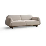 Modern rounded sofa with white boucle fabric and wooden base, luxury turkish furniture.