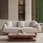 Laos Sofa Set by SofaTurkey featuring a modern rounded design in premium white boucle fabric, including two sofas and an armchair in a minimalist living room setting.
