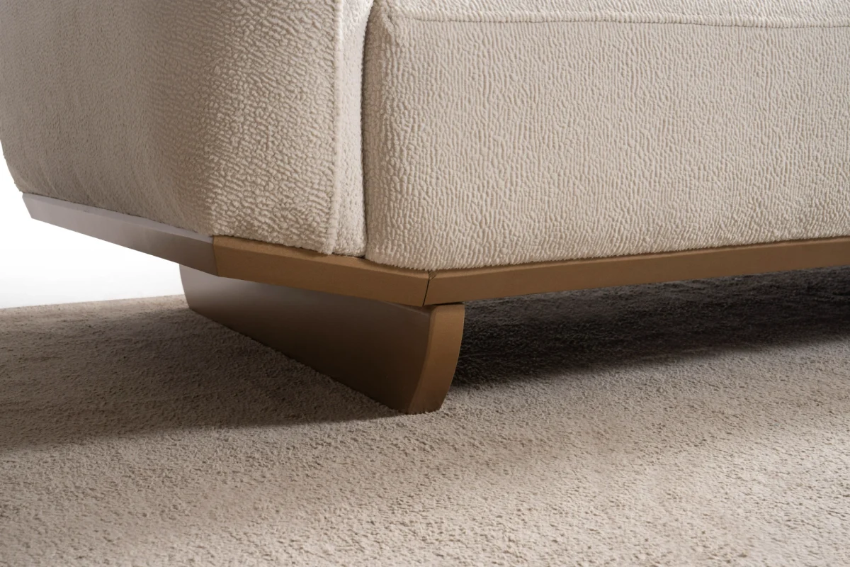 Laos Armchair - Minimalist rounded boucle accent chair with tapered wooden legs.