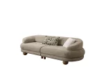 Premium sand grey curved sofa with sculptural round wooden legs and decorative cushions