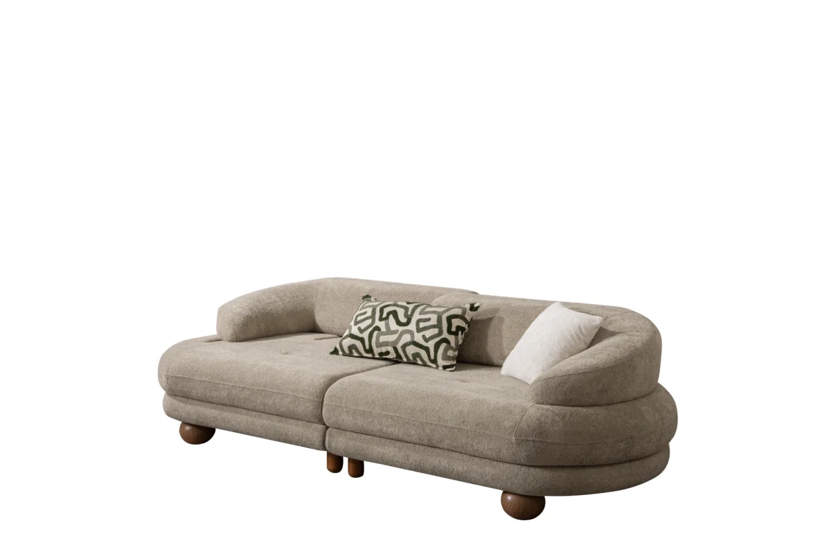 Premium sand grey curved sofa with sculptural round wooden legs and decorative cushions