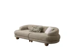 Premium sand grey curved sofa with sculptural round wooden legs and decorative cushions
