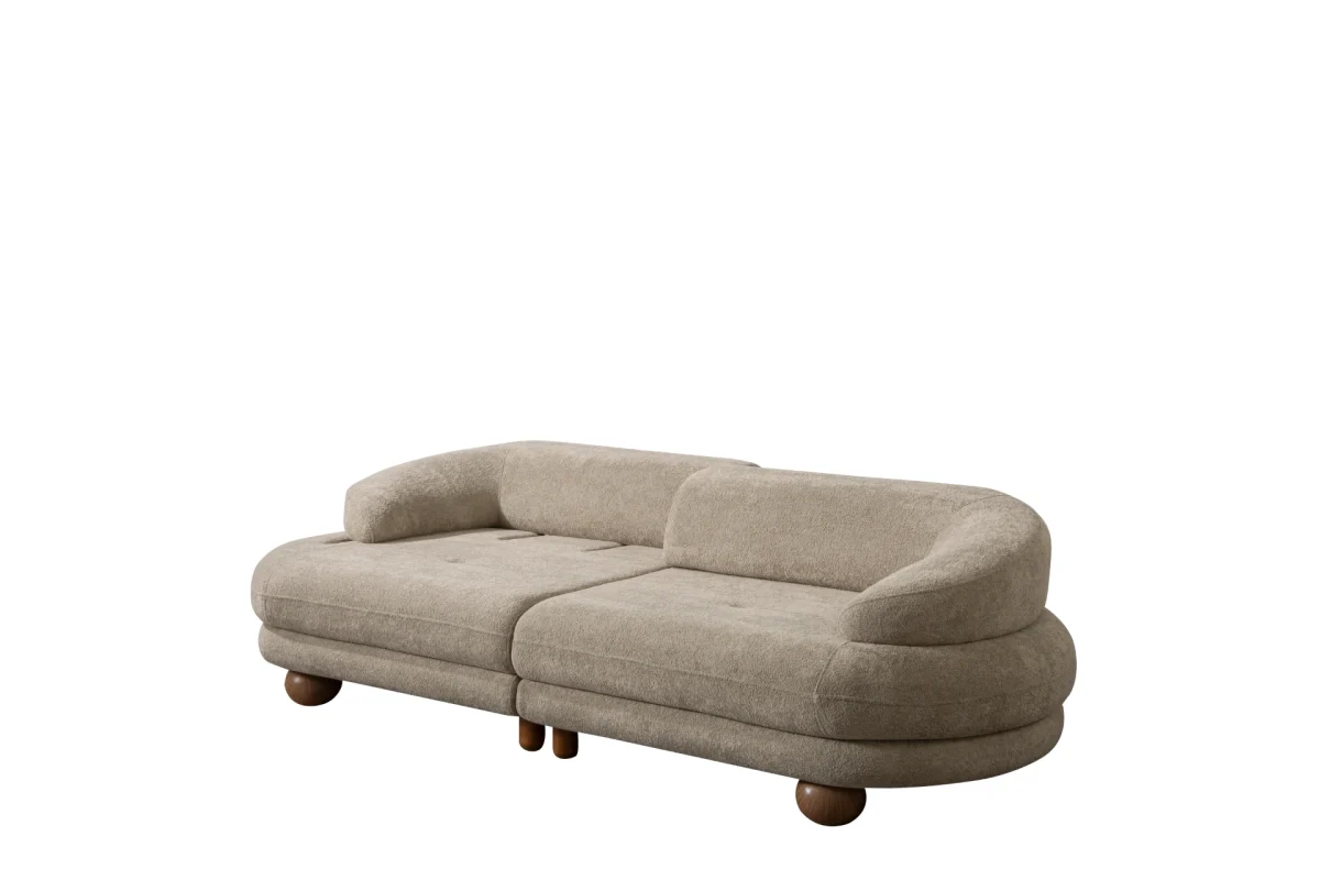 Premium sand grey curved sofa with sculptural round wooden legs and decorative cushions
