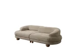 Premium sand grey curved sofa with sculptural round wooden legs and decorative cushions