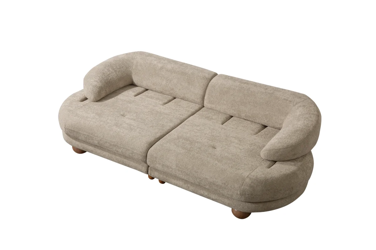 Premium sand grey curved sofa with sculptural round wooden legs and decorative cushions
