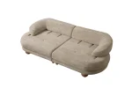 Premium sand grey curved sofa with sculptural round wooden legs and decorative cushions