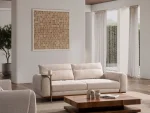 A modern textured fabric sofa featuring rounded armrests, adjustable horizontal back cushions, a dark wood plinth base, and a sleek integrated metallic side tray table in a minimalist living room setting.