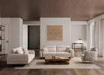 A modern textured fabric sofa featuring rounded armrests, adjustable horizontal back cushions, a dark wood plinth base, and a sleek integrated metallic side tray table in a minimalist living room setting.