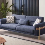 Lina Two Seater Sofa featuring modern armrest accents, subtle metallic legs, and a wide seating surface.