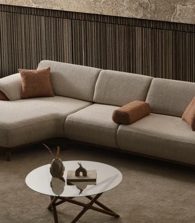Loria Chaise Corner Sofa – 3 Modules three-piece modern beige sectional sofa featuring an extended chaise lounge, warm wooden arm details, terracotta accent pillows, and dark wooden legs.