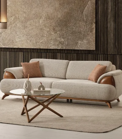 Loria Sofa combines organic curved contours, refined wooden armrest accents, and plush seating comfort to elevate modern living interiors. Experience premium quality with SofaTurkey™️.