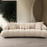The Loris Sofa brings sculptural elegance to your home. With its signature texture and soft fabric, it offers a sophisticated relaxation experience for contemporary living.