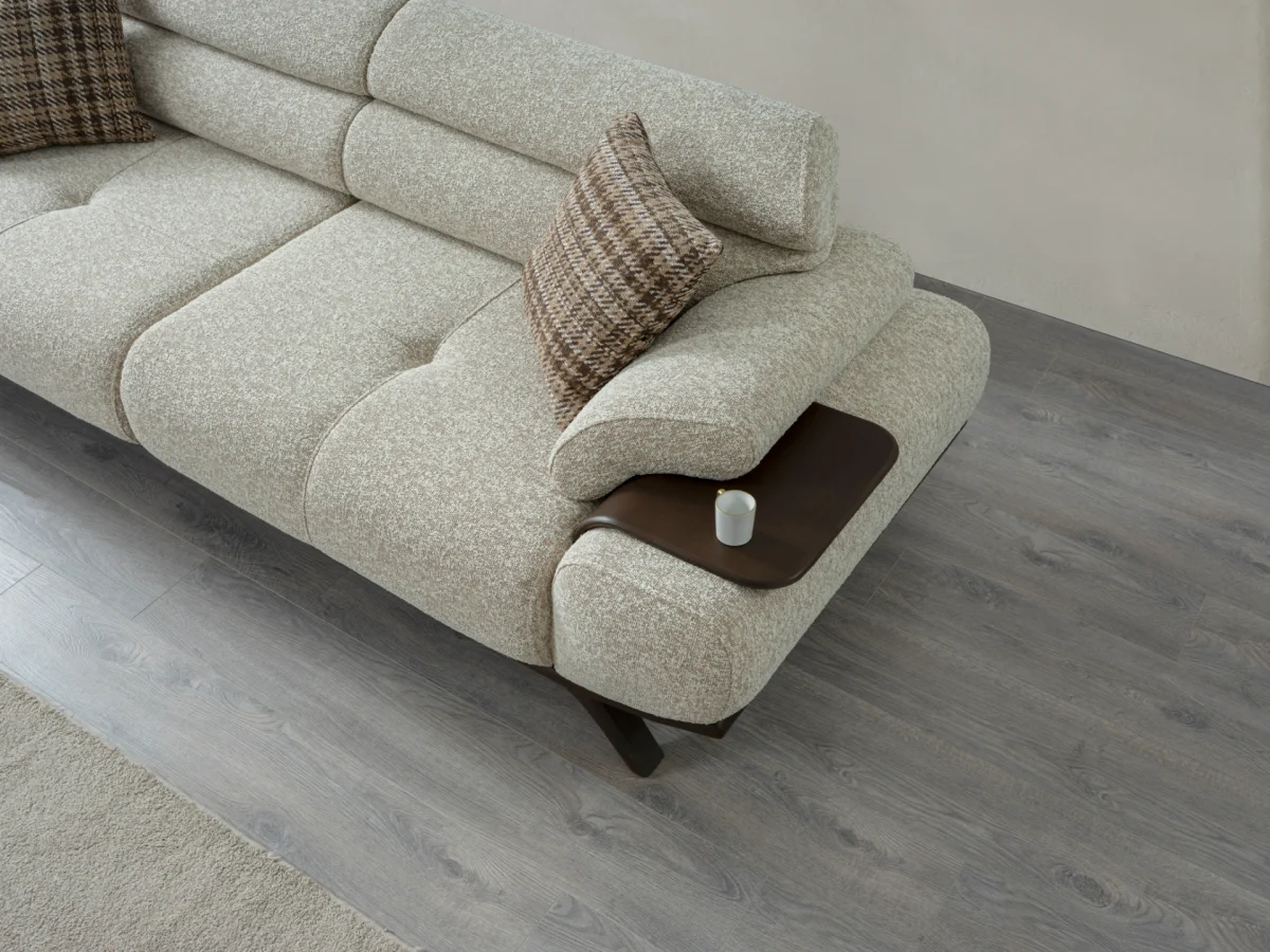 The Maya Sofa combines organic curves with functional luxury. With its fashionable texture and integrated side trays, it's the ultimate statement piece for modern European homes.