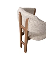 The Milan Dining Chair is a masterpiece of modern seating design, crafted to add an "Organic Modern" elegance to your dining room. Its distinctive curved backrest is meticulously designed to provide ergonomic support while maintaining a sleek and minimalist silhouette. Upholstered in our signature premium fabric, this chair offers both a comfortable and sophisticated tactile experience.