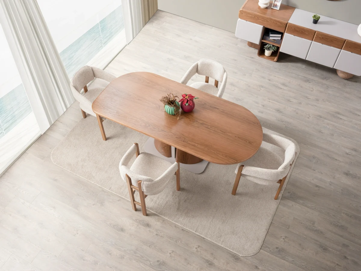 The Milan Dining Table Set is a masterpiece of contemporary craftsmanship. Designed to be the heart of your home, this set includes a stunning dining table with a bold, sculptural pedestal. Its rounded edges create an atmosphere perfect for long meals and meaningful conversations.