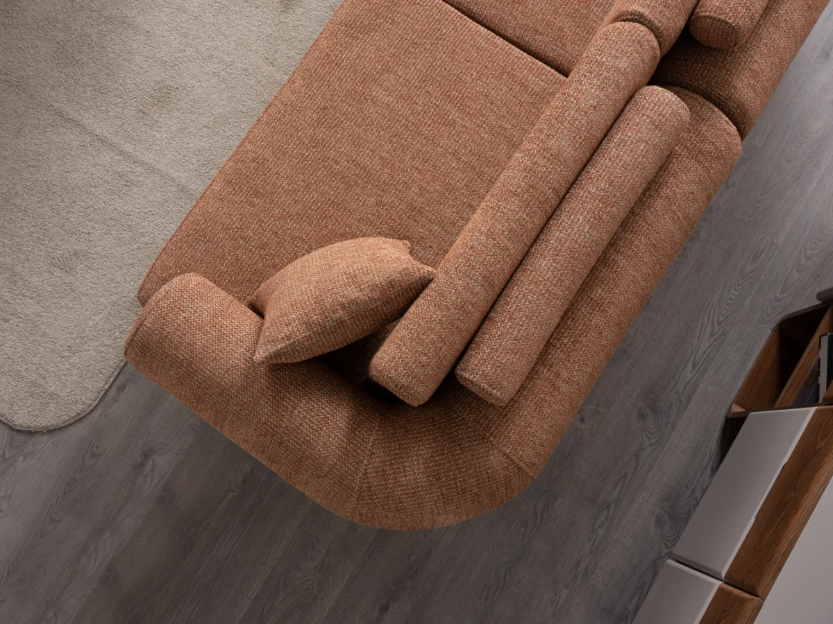 The Milan Sofa is an expression of modern elegance and organic design. This unique sofa is meticulously crafted for contemporary European homes. The rich, tactile fabric adds warmth and a high-end feel to any living space.