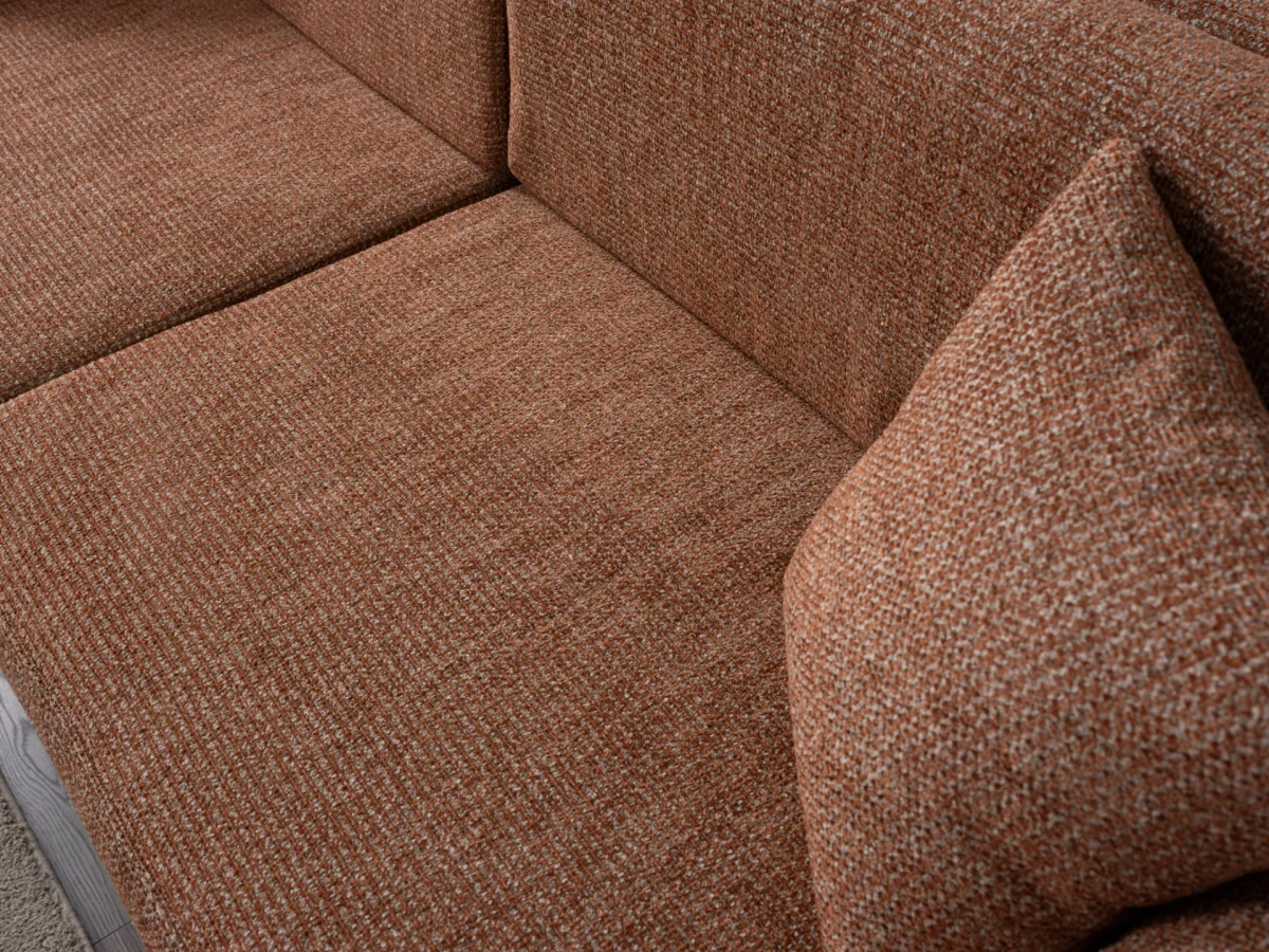 The Milan Sofa is an expression of modern elegance and organic design. This unique sofa is meticulously crafted for contemporary European homes. The rich, tactile fabric adds warmth and a high-end feel to any living space.