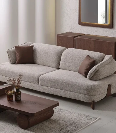 The distinguished Mirae Sofa in a bright, modern interior with curved architectural details and warm wooden accents, embodying a sense of balance and harmony.
