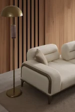 A prestigious Nadora Sofa arranged in a grand, high-ceiling living room, reflecting a luxurious and sophisticated lifestyle.