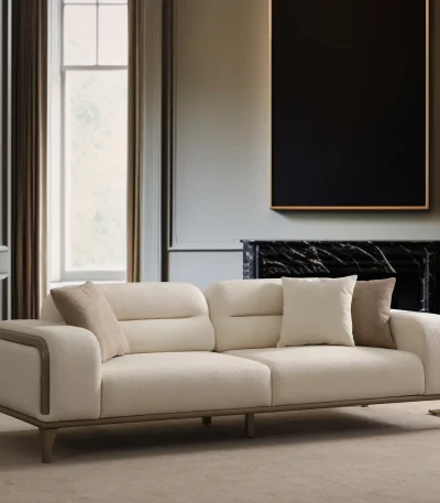 A prestigious Nadora Sofa arranged in a grand, high-ceiling living room, reflecting a luxurious and sophisticated lifestyle.