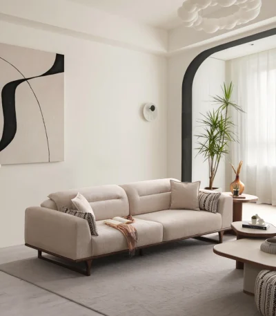 The Noa Sofa is a masterpiece of contemporary Turkish craftsmanship, designed exclusively for distinguished European homes. Its fluid, organic silhouette is upholstered in high-quality fabric that invites you to relax. This sofa is more than just a piece of furniture; it's a style statement that adds an airy, modern feel to any living space.